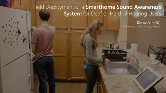 First slide of the talk. A scene of a kitchen in the background with the talk title: Field Deployment of a Smarthome Sound Awareness System for Deaf and Hard of Hearing Users